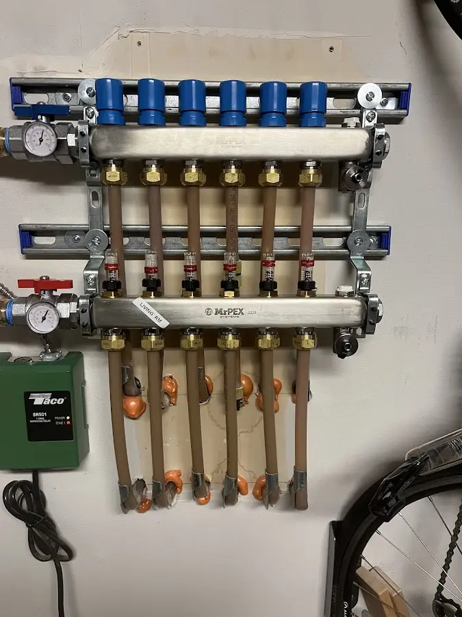 Plumber performing Water Heater Repair at a residential property in Horicon